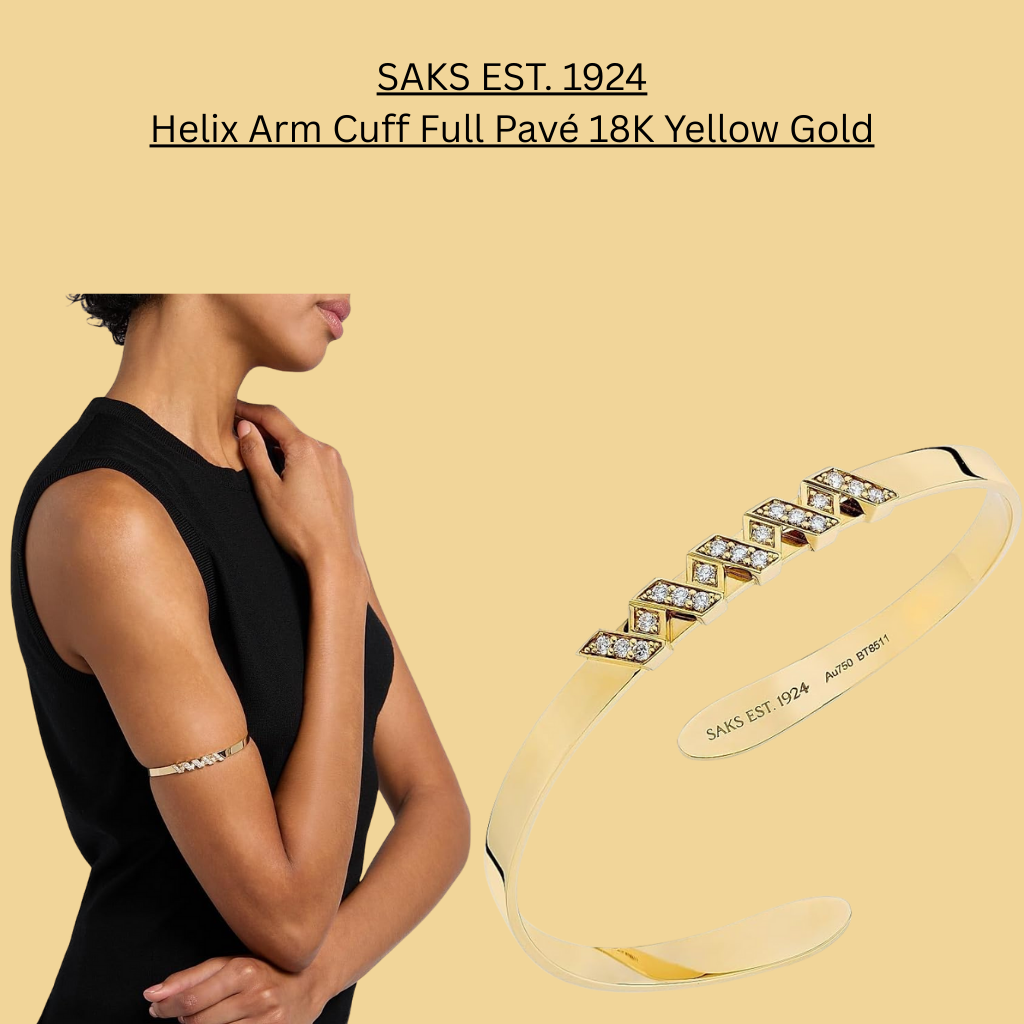 SAKS EST. 1924 Helix Arm Cuff Full Pavé crafted in 18K yellow gold, featuring a sleek open cuff design with pavé-set diamonds, high-polish finish, and engraved brand detailing, shown worn on the upper arm.