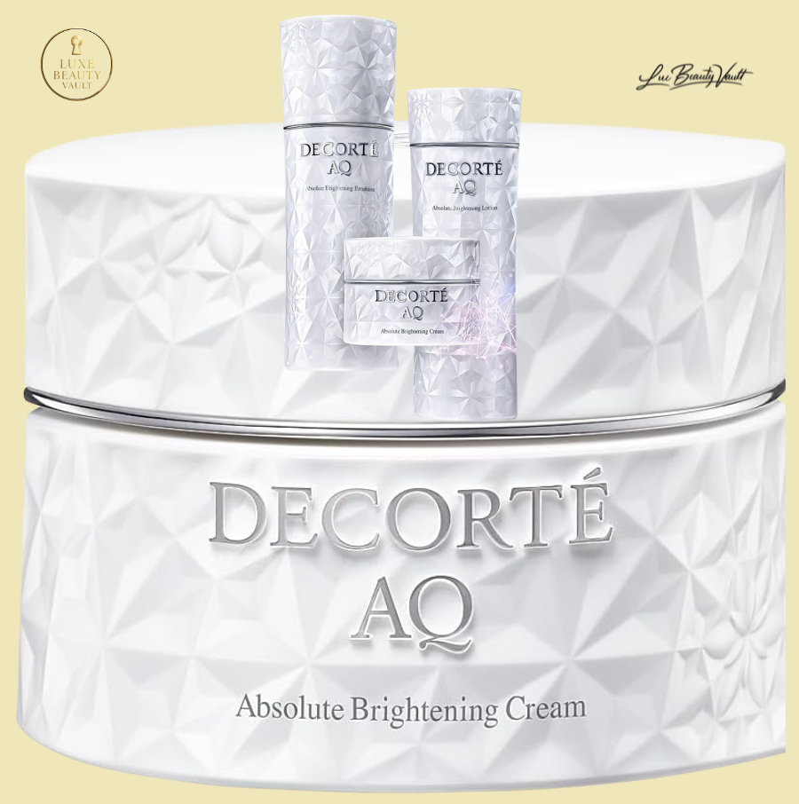 Decorté AQ Absolute Brightening Cream in elegant white faceted luxury packaging, shown with coordinating skincare bottles, a premium Japanese brightening face cream formulated to hydrate, balance melanin production, reduce hyperpigmentation, and improve skin tone and radiance, featuring kojic acid, botanical extracts, peptides, and advanced encapsulation technology for smooth, firm, and luminous skin.