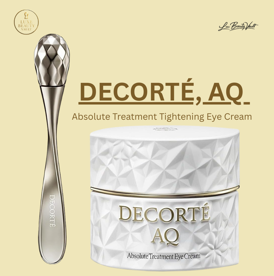 Decorté AQ Absolute Treatment Tightening Eye Cream in elegant white faceted jar with gold detailing, shown with a silver massager tool, a luxury Japanese eye cream designed to tighten and tone the delicate eye area, promote radiance, strengthen and repair skin using botanical extracts, peptides, and Shirakaba White Birch water for a firmer, smoother, and well-hydrated appearance.