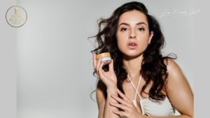 Woman holding a luxury skincare cream jar, showcasing premium beauty care with a focus on hydration, glow, and high-end skincare results.
